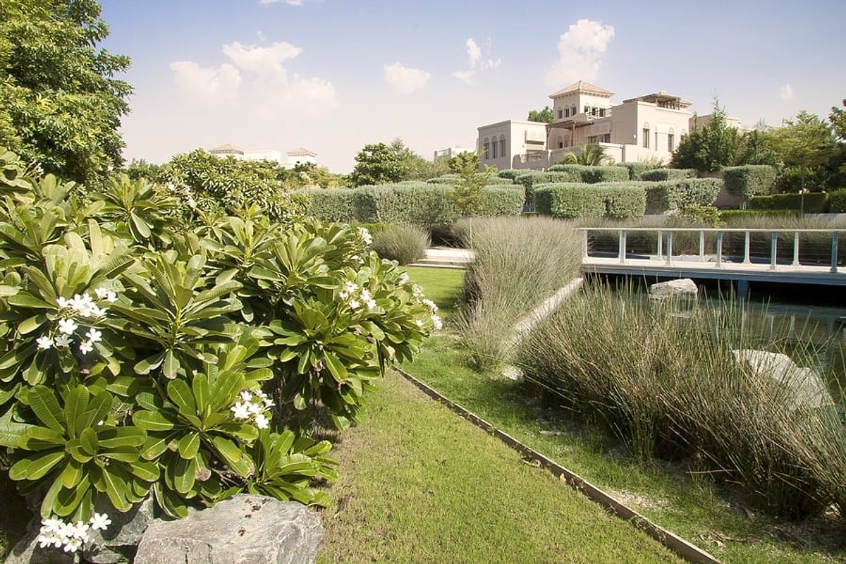 Gardens, frangipani and a villa in Al Barari